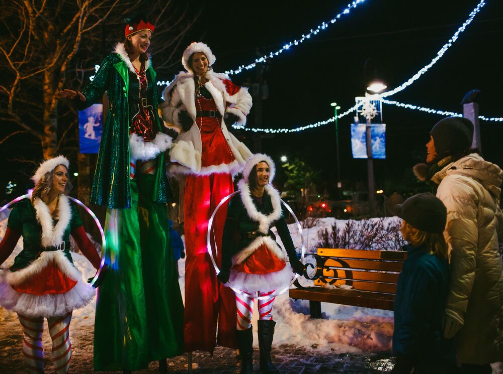 Performers on Banff Ave during the Santa Claus Celebration of Lights in Banff NAtional Park.